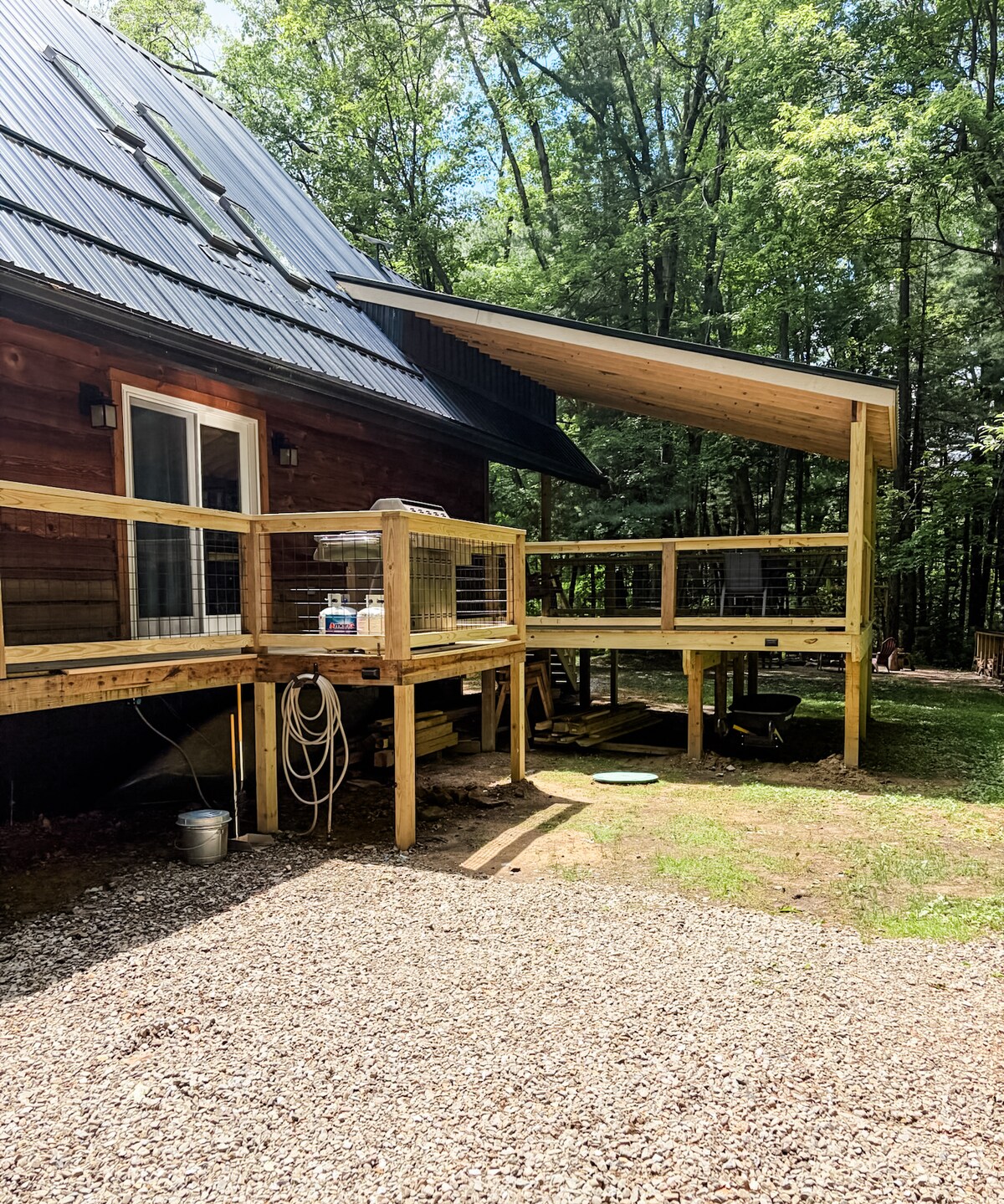 Renovated deck with a new covered deck, to enjoy your morning coffee at Sweet River Lodge in Tionesta