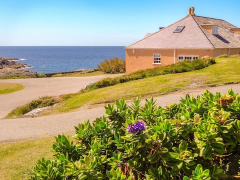 Iconic beach house spectacular views, huge garden.