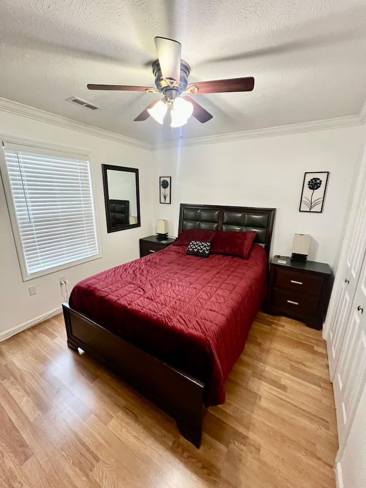 Bedroom #2 with Queen bed, closet, dresser and mounted TV with Spectrum App.