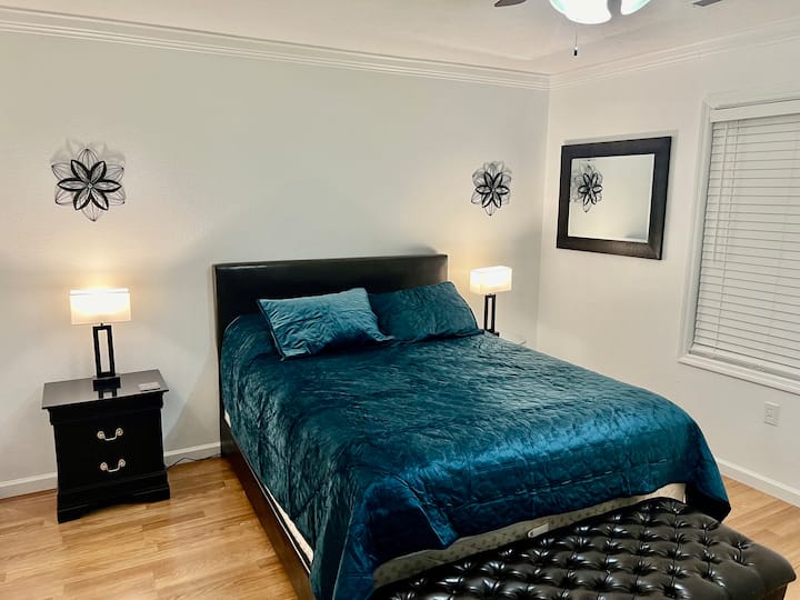 Bedroom #3 with Queen bed, USB night lights, closet, dresser and mounted TV with Spectrum App.