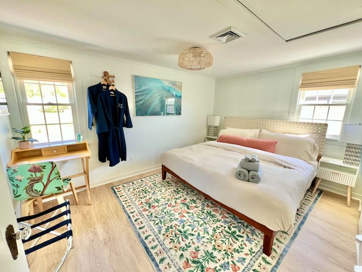 The secondary (or "Sand") bedroom has a King sized bed, dedicated workspace with desk and chair, and built-in drawers and shelves. This room also has a large smart TV.