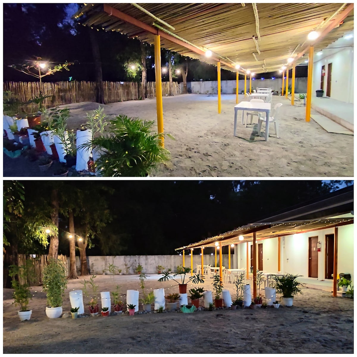 An open sandy space is illuminated by soft lighting, featuring potted plants arranged along the perimeter. A simple table stands in the center, with a backdrop of several doors leading into living areas, all set beneath a sheltered roof.