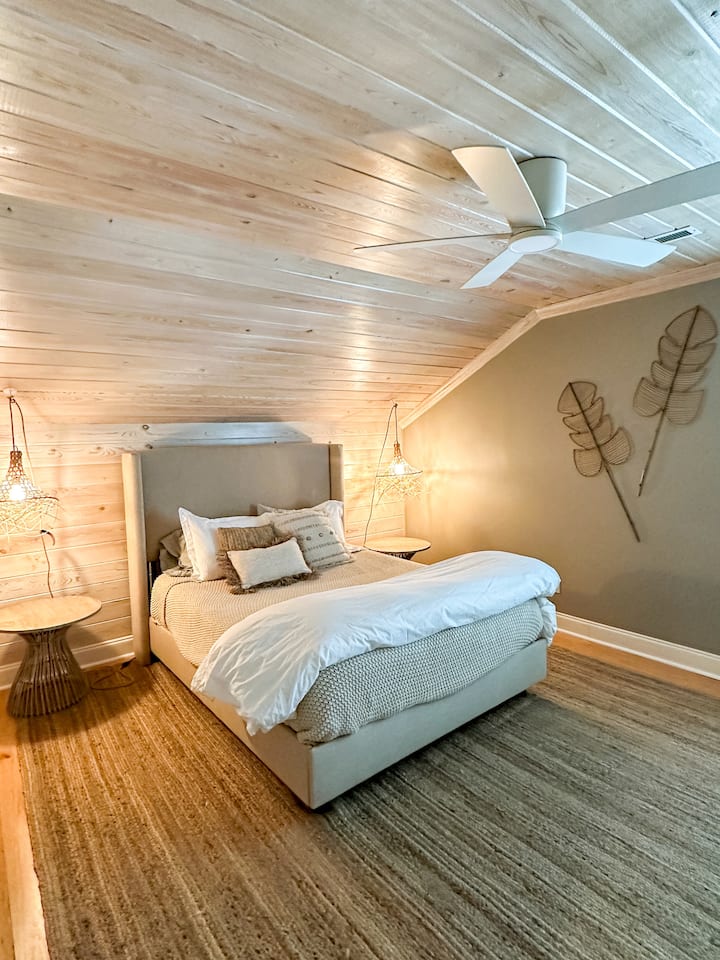 Room 7 - complete with new queen memory foam cooling mattress, new 40” Roku smart TV, custom lighting sourced from Bali, ceiling fan, alarm clock with wireless phone charging, shared bathroom, closet, plantation shutters, new paint, and more.