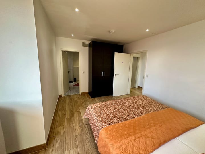 Bedroom with private bathroom and toilet