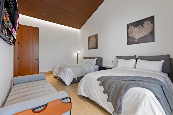 4th Suite Double Bedroom- Two Double Bed/ Smart TV / Sofa / Walk-in closet / Ensuite Bathroom / Outdoor Space.