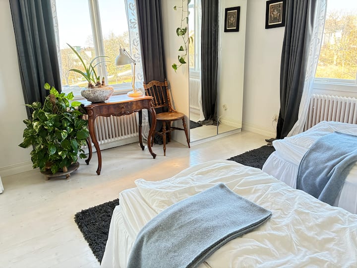 Two single beds (each 90 cm wide) with double wardrobe with full-length mirror. A lovely desk space. Windows facing south to the Baltic and west for evening views. 