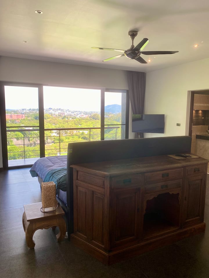 Treetop Villa - large 30sqm bedroom with king size bed, en-suite bathroom, mountain and sea view.