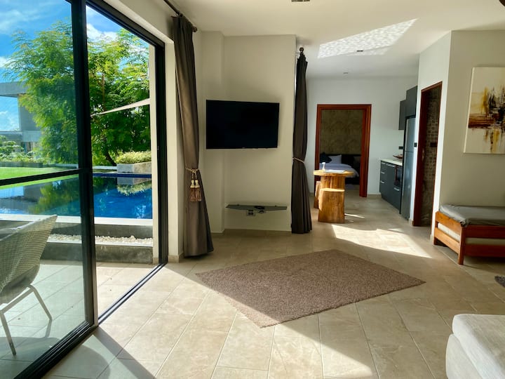 The apartment is connected to two terraces and the infinity pool with jacuzzi