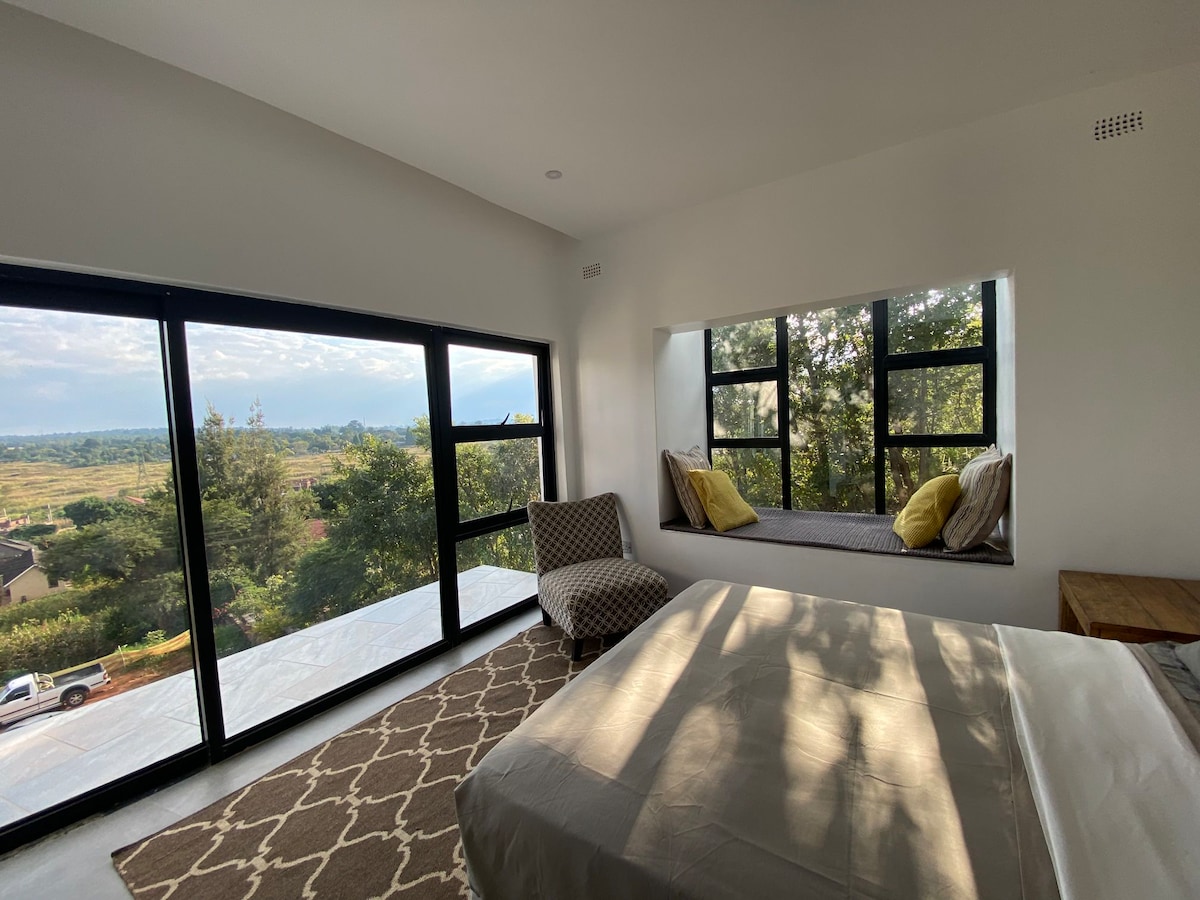The Treetop Penthouse — Floor-to-ceiling windows