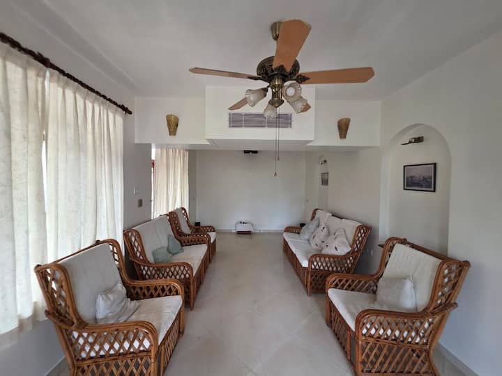 The living room has a home theatre with projector and an amazing music system