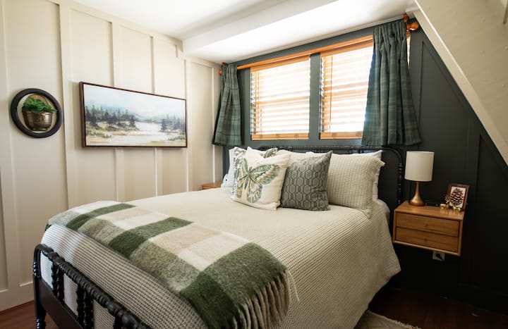 The cozy Evergreen room on the main floor is like a little cocoon just steps from the coffee maker or soaking tub!