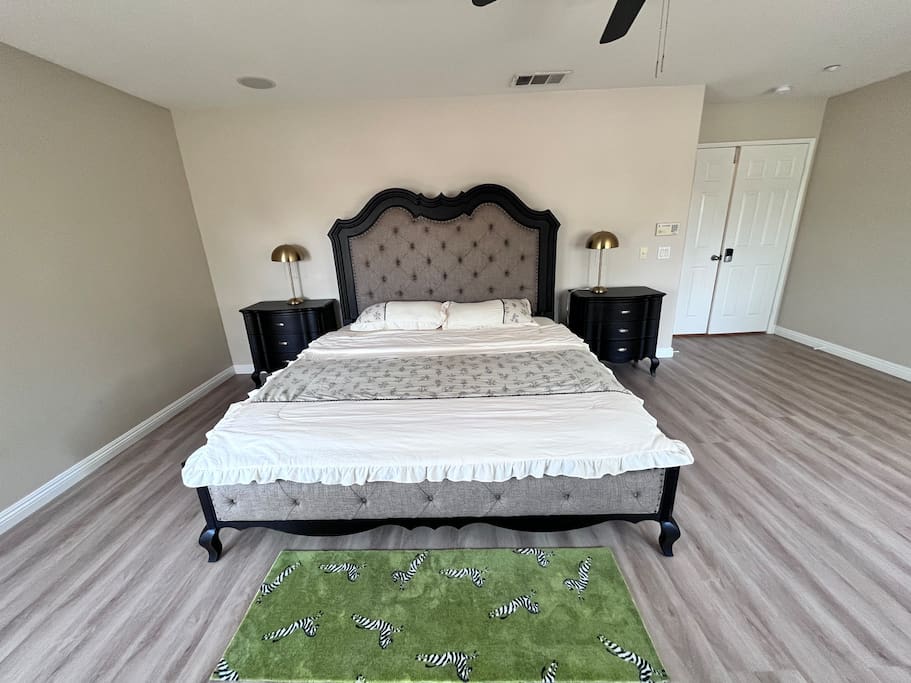 Airbnb Room 201,a spacious luxury bedroom with a king bed