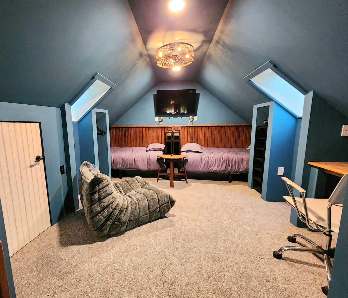 2 twin beds in the Loft plus TV. Skylights keep the space bright during the day.