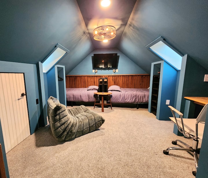 2 twin beds in the Loft plus TV. Skylights keep the space bright during the day.