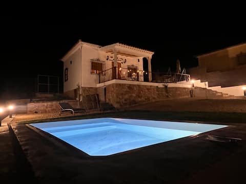 A rural house with a large garden, mini-pool, and sauna