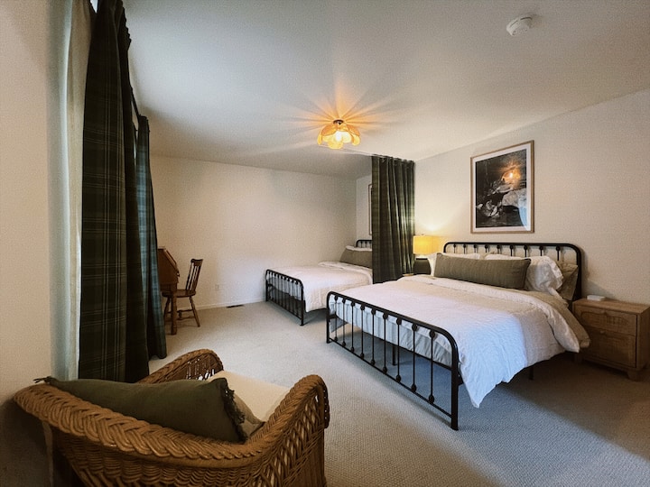 Two queen beds with curtain divider for privacy. 