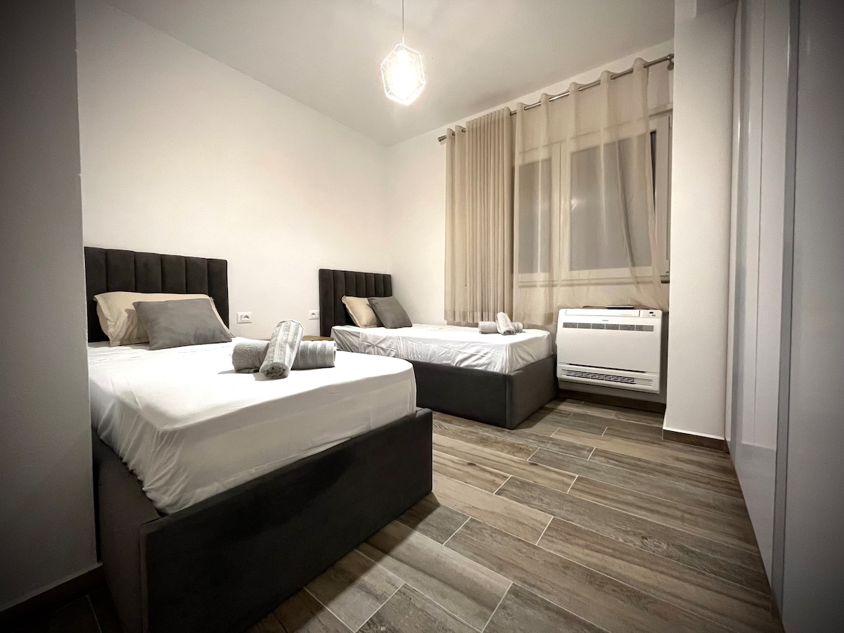 Dos camas individuales con colchones de memoria (20 cm) para un alto descanso cómodo