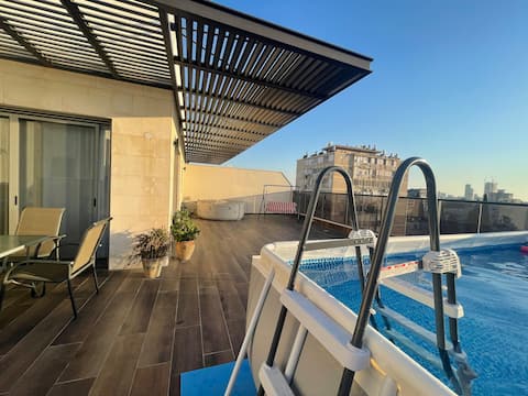 luxury penthouse with a hot-tub, pool and parking