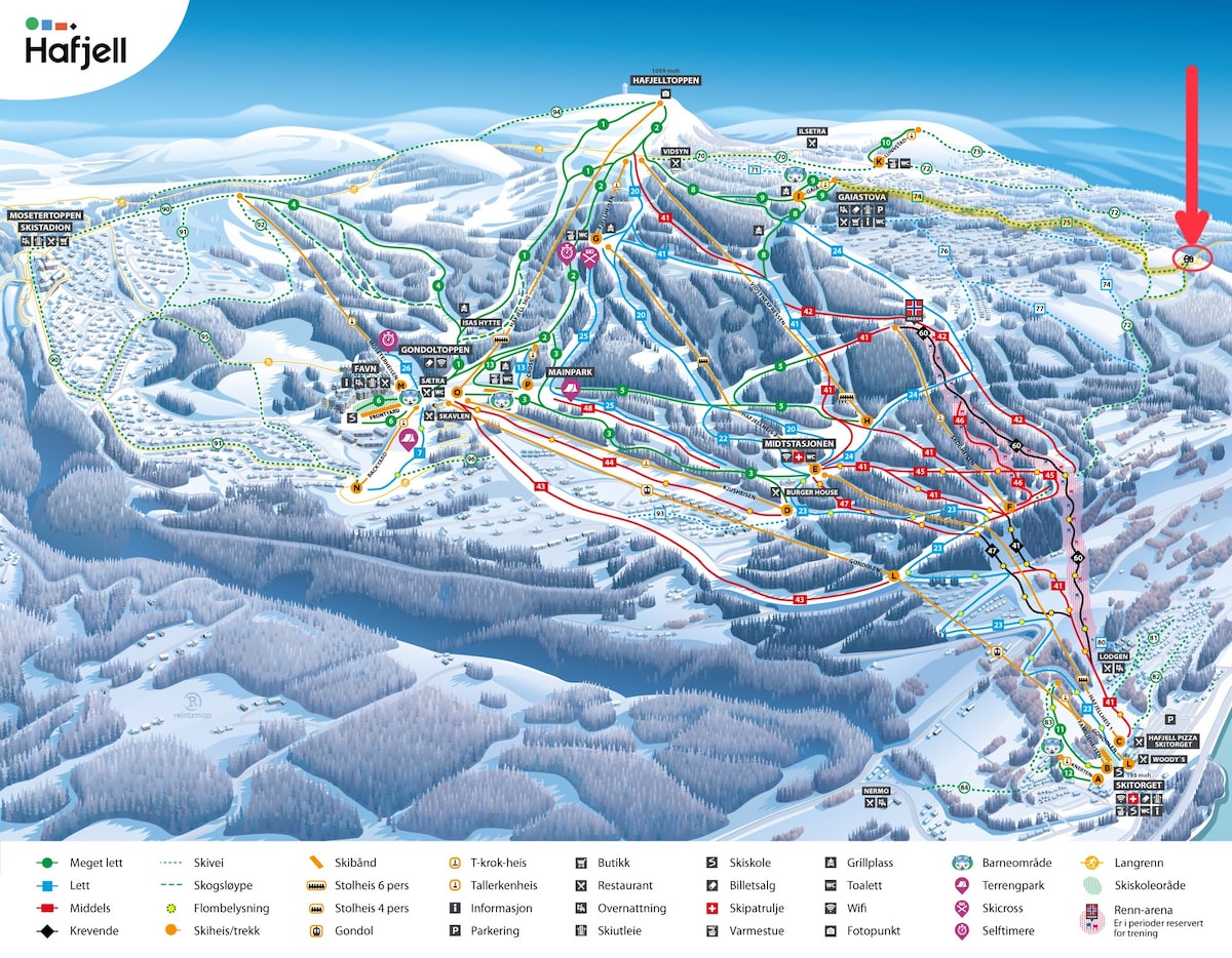 A detailed map of the Hafjell ski resort is displayed, showing various ski slopes and trails marked in different colors. Key facilities like lifts, parks, and rest areas are indicated with symbols. The surrounding snow-covered landscape offers a sense of the expansive recreational area.