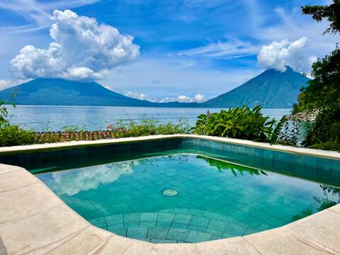 Hot spring hot tub with a view of volcanoes