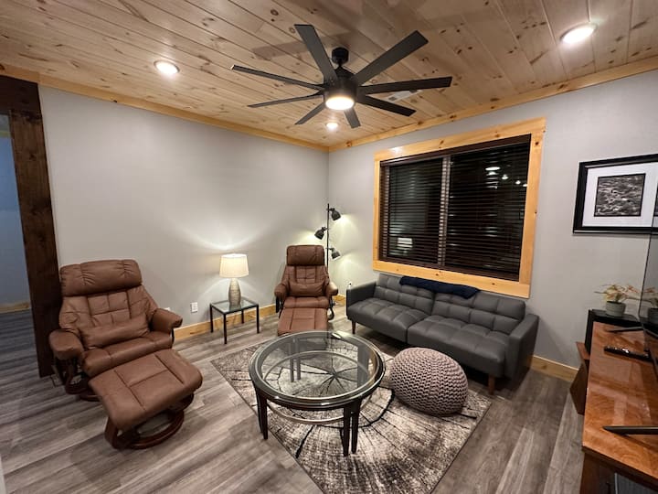 Apartment living room with a leather futon sleeper bed