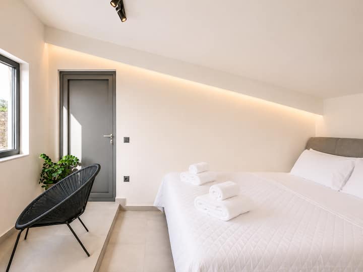 Attic Level - Bedroom 4 with queen-size bed