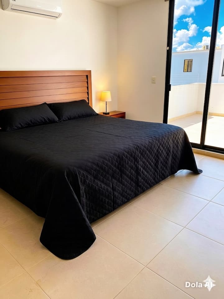 Minimalist Elegance and Comfort for Your Relaxation
​This bedroom has been designed to offer a haven of serenity and modernity. The contrast between the warm tones of the wood and the sophistication of the black creates a unique atmosphere.