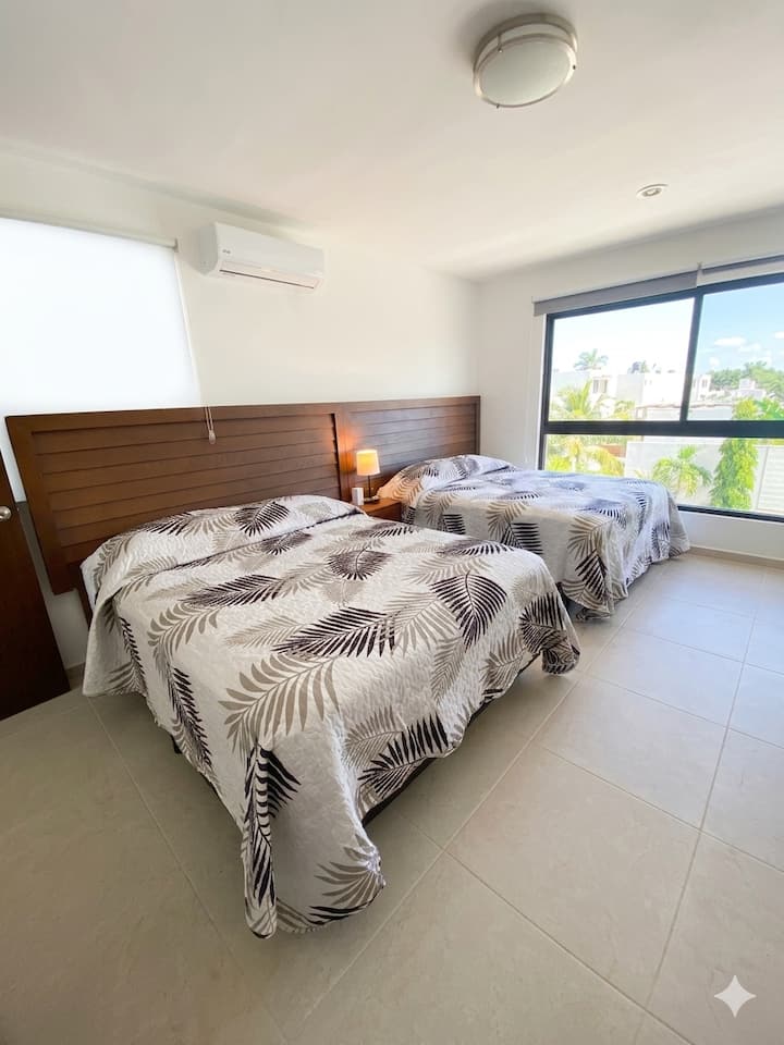 Spaciousness and Tropical Comfort 
​This bedroom is designed to maximize rest and functionality. With enviable natural lighting and a balanced décor, it is the perfect space for those traveling with a companion.