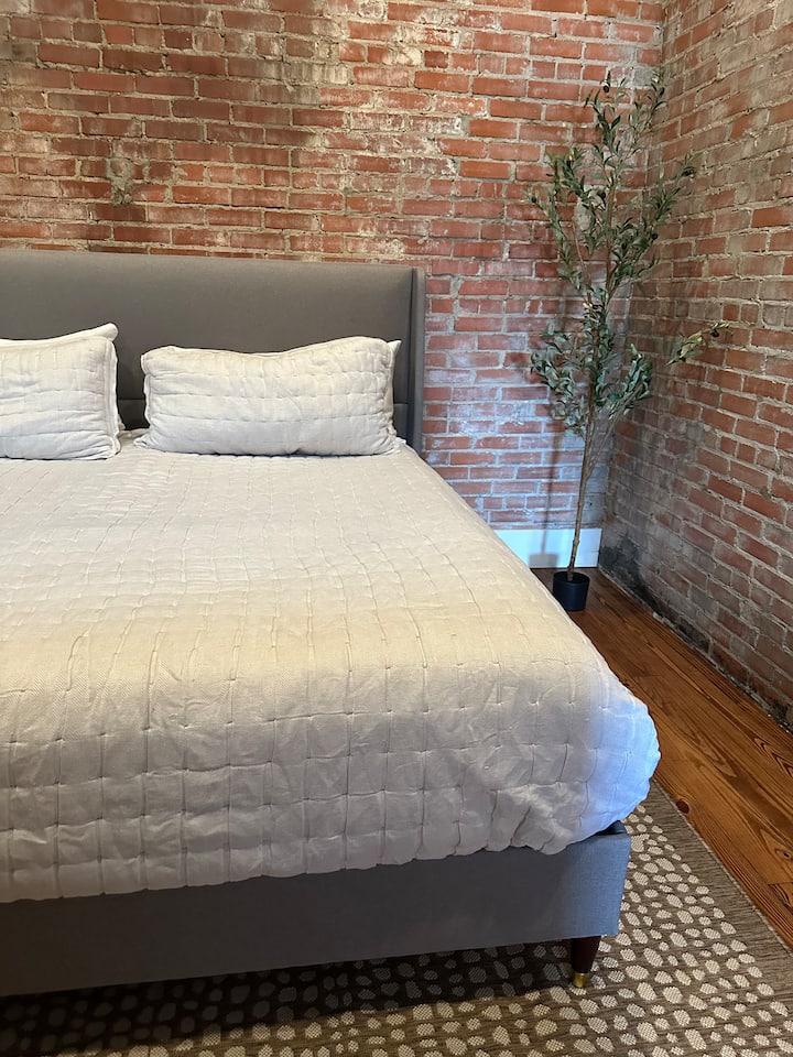 Master bedroom with king bed and tv