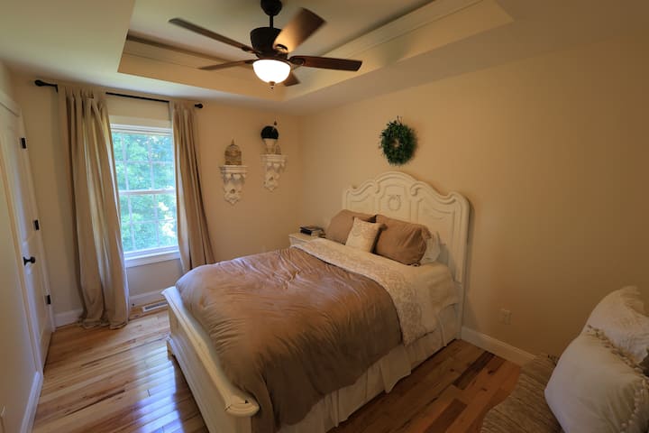 Bedroom 4 with ceiling fan. Has a door directly into the shared bathroom. Large closet as well.
