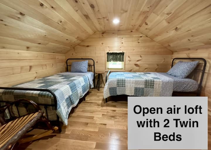 Two twin beds, and a rocking chair for all to enjoy! 
