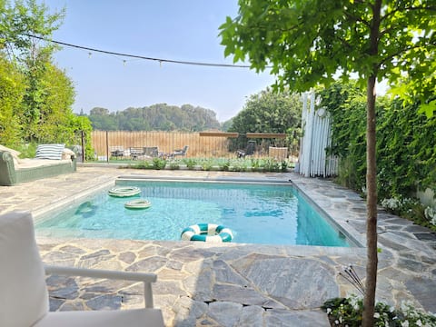 Villa with a pool and an open view of nature