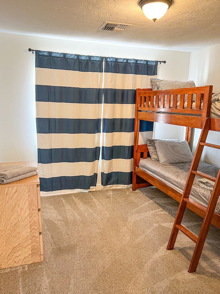Bedroom 4 is the ultimate kid’s room. With fun bunk beds, a dresser, and closet, this room is right off the playroom for easy access to fun!
