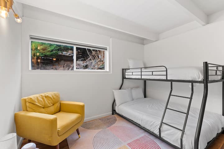 Twin over full bunk bed room, located downstairs. This room has a built in dresser, sound machine/alarm clock, and a full length mirror. Pack n play is located in closet (sheets are not provided for pack n play).