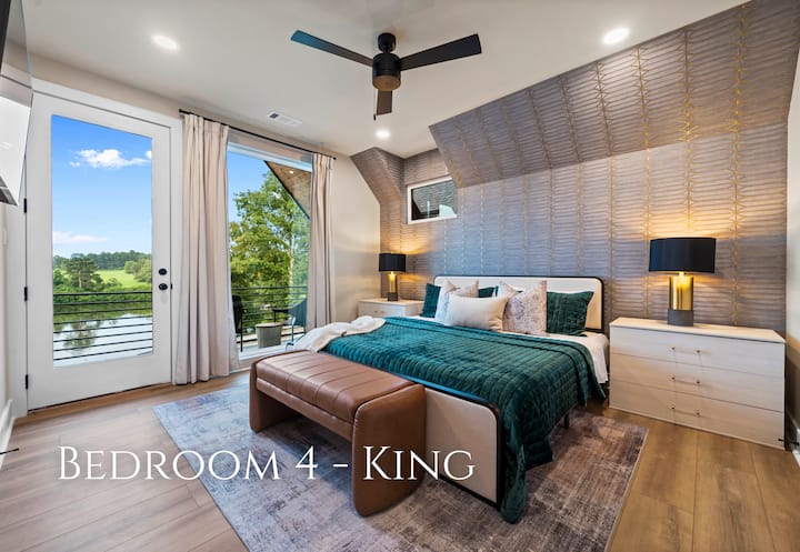 This bedroom features a king-sized bed with luxurious bedding and plush pillows, ensuring a restful and comfortable sleep.