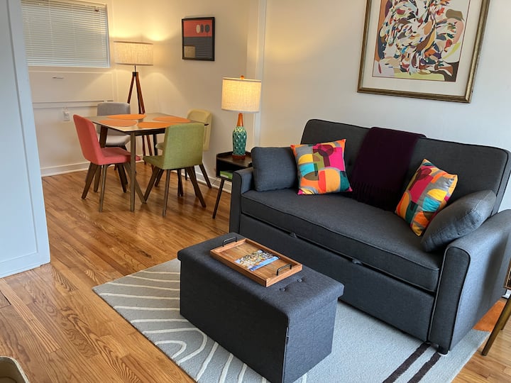 Pull out double sofa bed, handy ottoman holds linens  for sleeper.