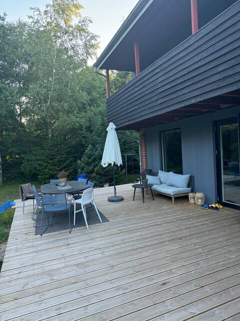 Large house close to forest and water