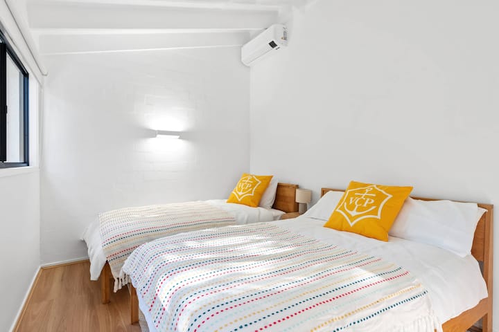 Spacious second bedroom featuring both a double and single bed