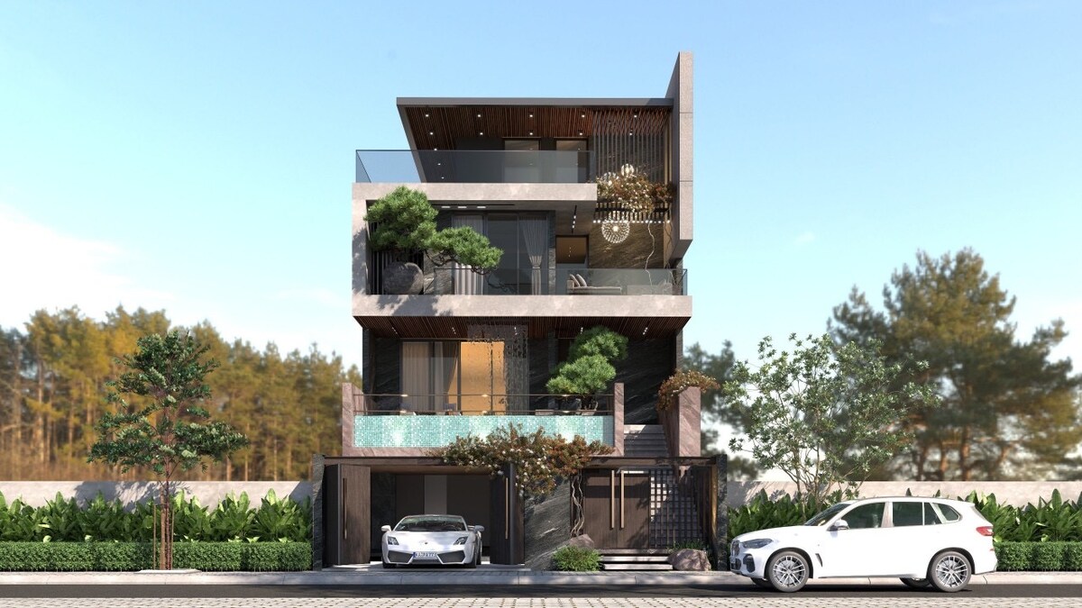 A contemporary three-story villa is showcased, featuring a modern façade with natural stone accents. Lush greenery surrounds the entrance, while two cars are parked in the driveway. Large windows offer a glimpse of the outdoor terrace, enhancing the villa's elegant design.