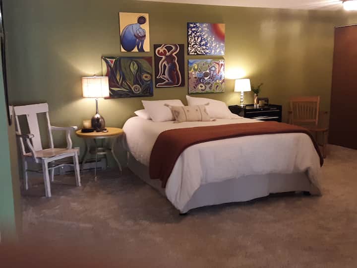 Master bedroom downstairs with attached full bathroom. 