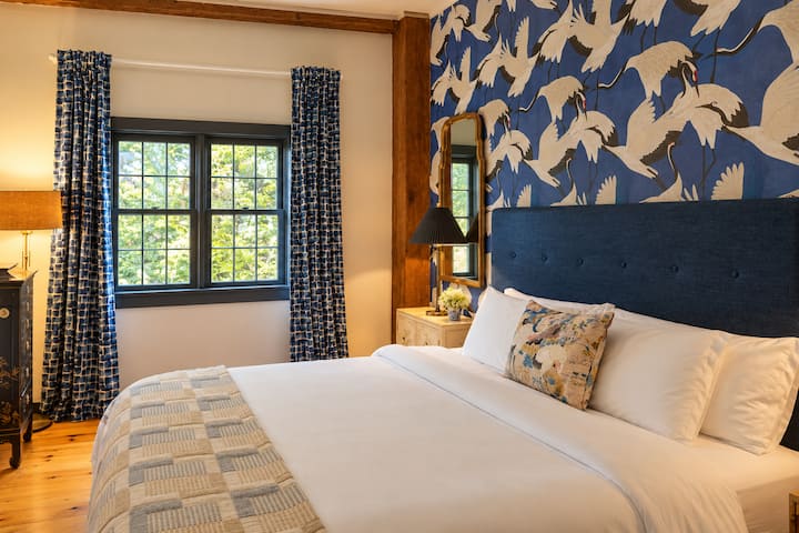 On the first floor, this bedroom has an Asian barn vibe.