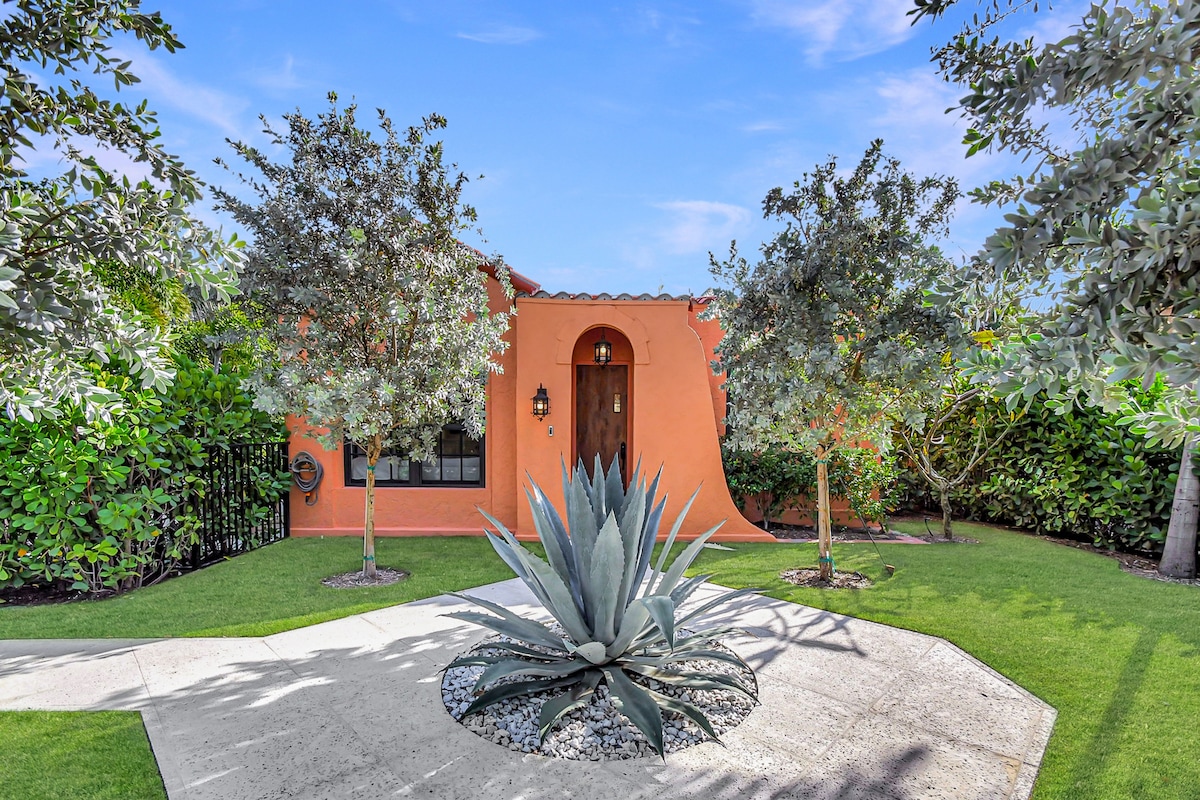 The namesake agave stands sentinel at the entrance — beyond it, pecky cypress and terracotta welcome you home.