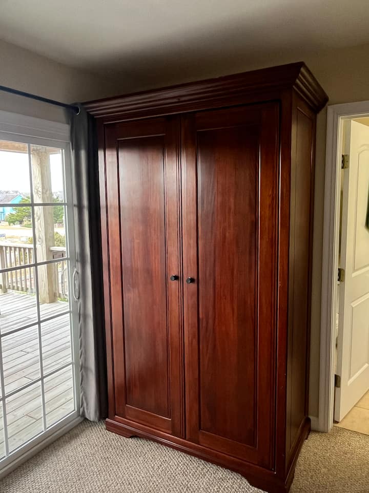 Wardrobe with drawers and space to hang garments 