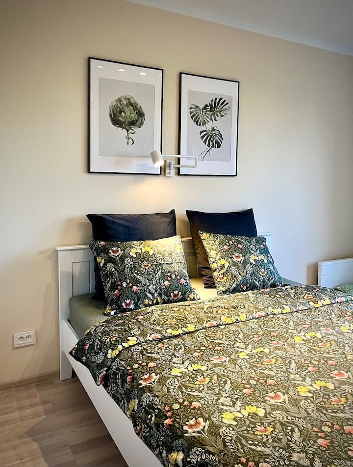 Cozy bedroom with dimmable lighting - for easy reading and setting the mood.