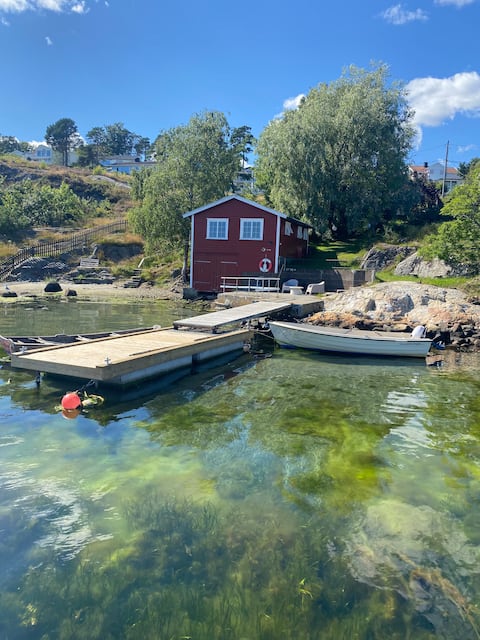 Idyllic boathouse/cabin by the lake.