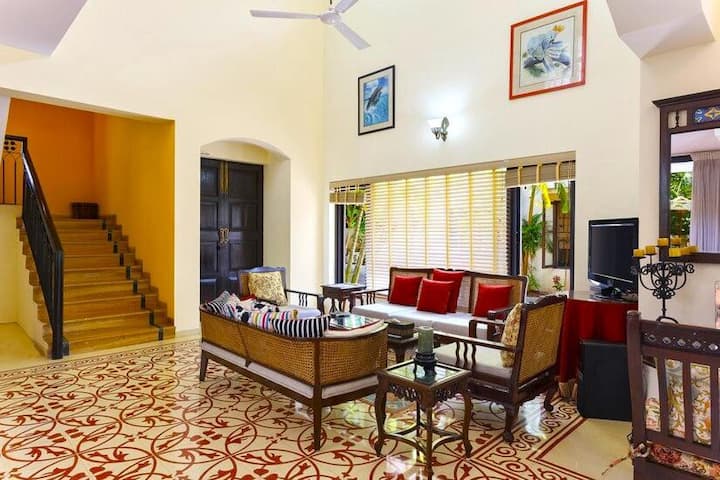 The living area is right next to the staircase that leads to the two bedrooms upstairs including the master bedroom