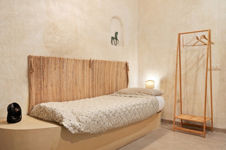 Sofa set up as a bed.
Upon your arrival, you will find it set up as a sofa. Under the sofa cover, you will find the sheets already fitted for rest.
You will find a small closet for the third guest (with blankets, sheets, and a pillow placed on top)
