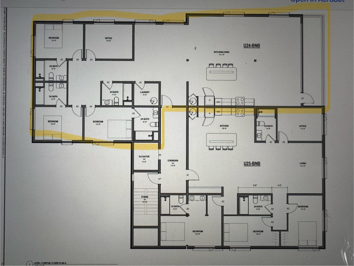 A detailed floor plan outlines the layout of a spacious apartment. Key areas include multiple bedrooms, bathrooms, and an open living area adjacent to the kitchen. Clear pathways indicate accessibility, and designated spaces for laundry and storage are marked for convenience.