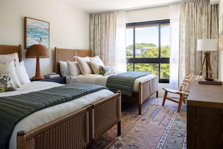 Bedroom 2 has two queen beds and the  bedding is as cozy as it is beautiful! Message us to find out about our mattresses. 

