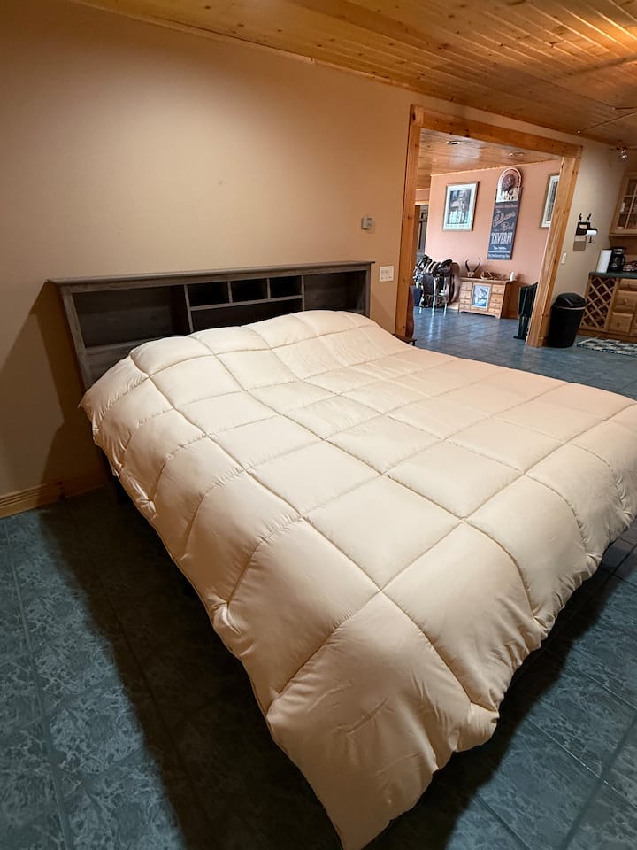Not a traditional bedroom. This is a king bed in a semi private area of the basement. It does not have a door to close it off from the living room but it is in a seperate more secluded area off of the basement living room. 